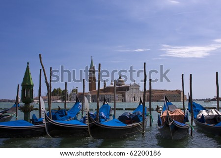Gondolas moored by the Grand Canal in Venice Italy