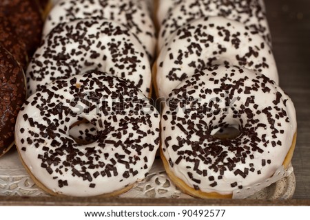 Iced doughnuts on display in a bakery