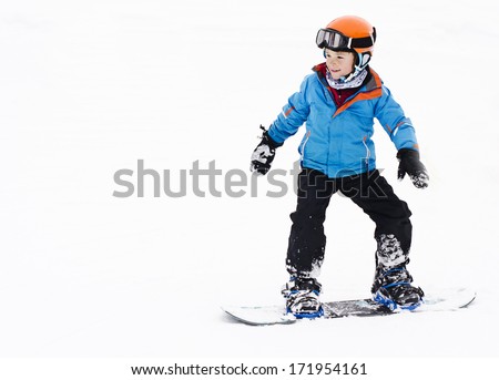 Cute, Young Boy Snowboarding