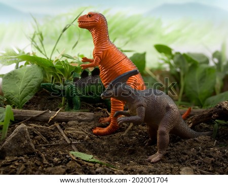 Jungle Dinosaur4. Dinosaurs stegosaurus, tyrannosaur & parasaurolophus standing on nature and leaf background.
