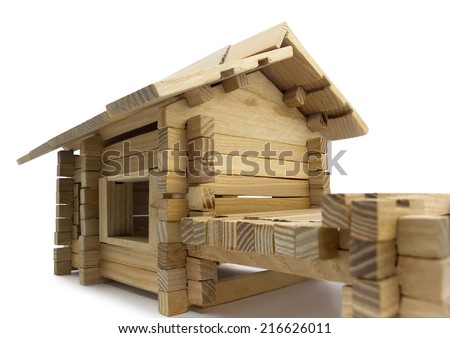 Wooden house. Isolated wooden toy house close view.