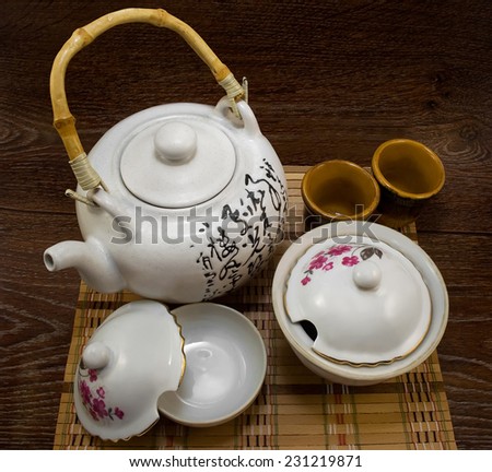 Tea set.Isolated beautiful tea set on wooden textured table.