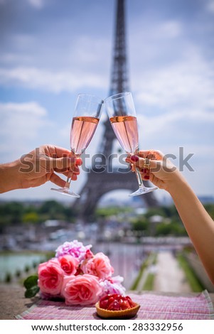 Wine glasses and Eiffel tower in Paris in spring