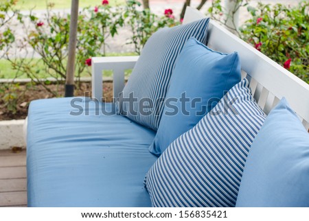 Sofa With Pillows On The Background Of Garden