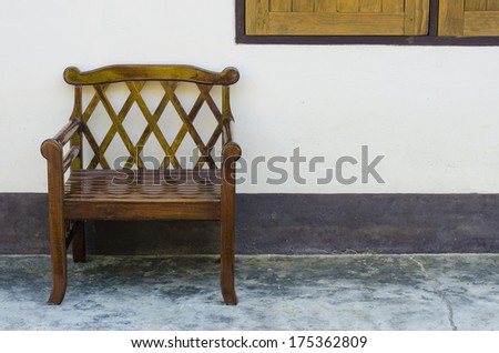 One chair in front of wall