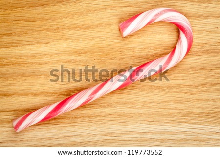 Christmas candy cane on wood texture