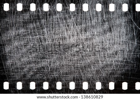 Blank grained scratched film strip texture background