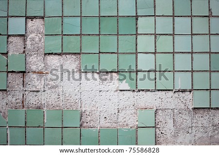 Texture of the old tile wall with cracks