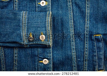 Closeup shot of blue jeans jacket front and sleeve