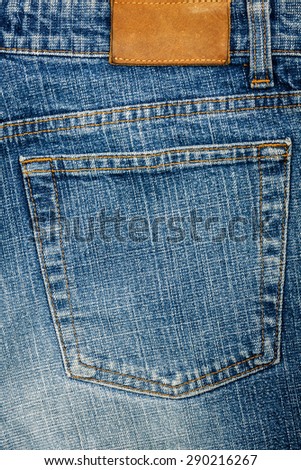 Blue jeans fabric with back pocket and a label background