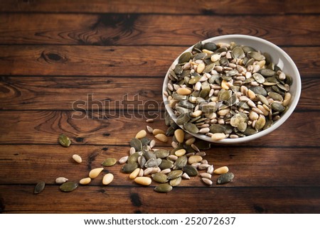 mixed seeds in white bowl
