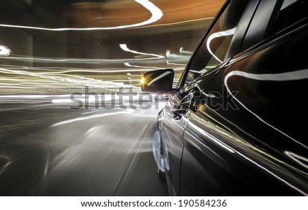 driving trough city, bulb exposure, rigged camera on left side of a german black during night,\
special effects photography