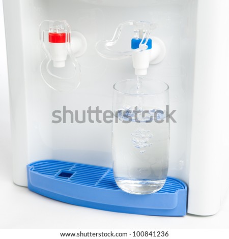 pouring a glass of water from dispenser