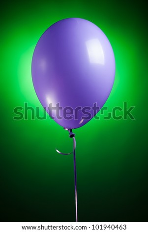 festive purple balloon on green