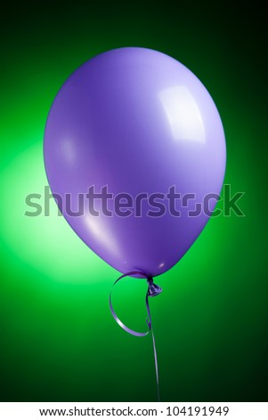 festive purple balloon on green