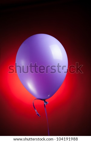 festive purple balloon on red