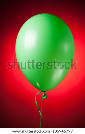 festive green balloon on red