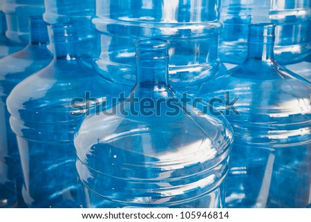 big empty water bottles at warehouse