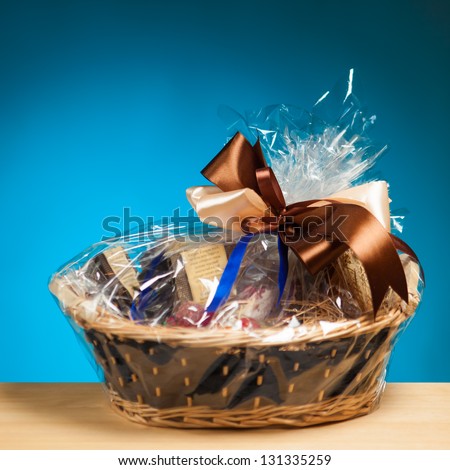 gift in a basket against blue background