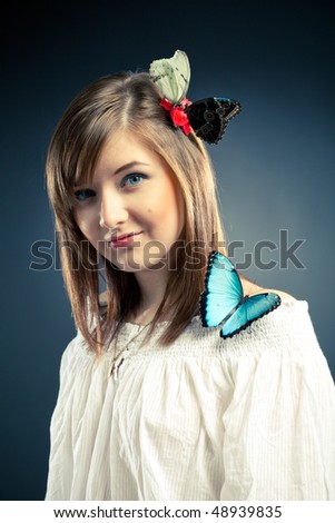 beautiful girl and butterfly on her shoulder