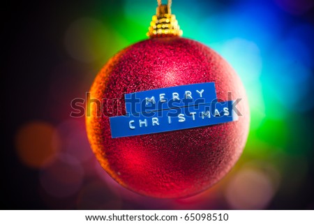 Christmas ball with title and colorful background