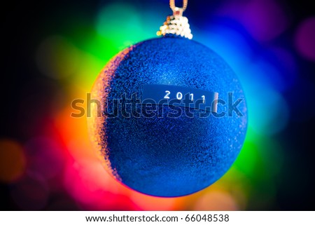 Christmas ball with 2011 title and colorful background