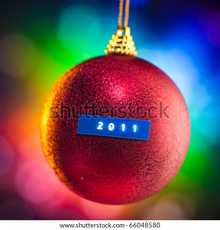 Christmas ball with 2011 title and colorful background