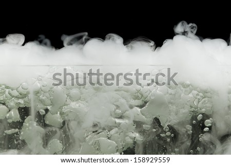 boiling dry ice with vapor, closeup view
