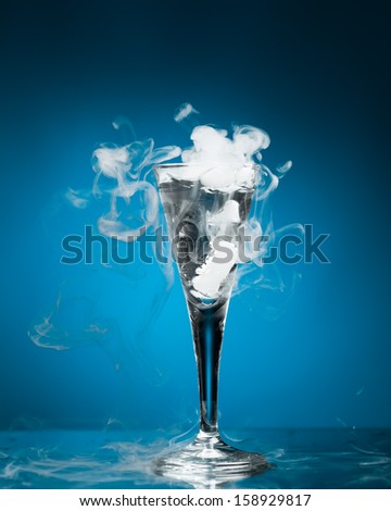 shot glass of vodka with ice vapor
