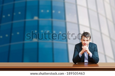 business man against office windows background