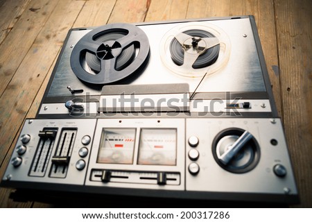 reel to reel tape player and recorder on wooden background