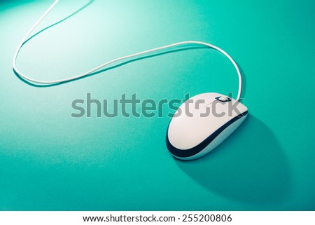 computer mouse on emerald background