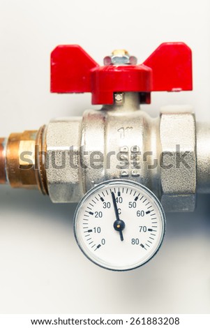 temperature gauge with water tap in boiler-room