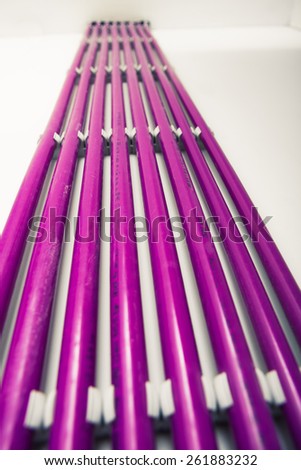 purple plastic pipes of underfloor heating system