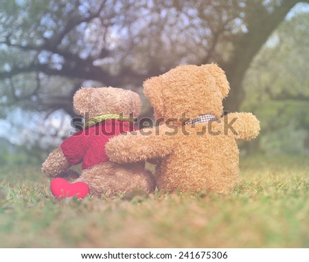 Two teddy bears sitting in the garden with love. Concept about love and relationship (Soft Style for Background)