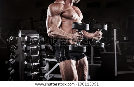 muscular body building men training at the gym