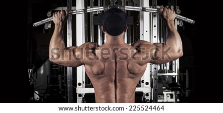 muscular body building men training his back at the gym