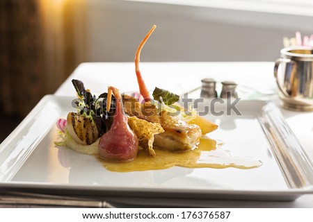 pork belly with baked apples in a fine dining preparation