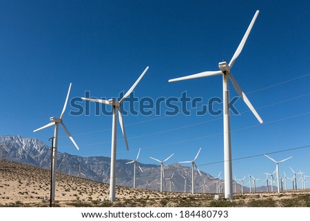 Windmills against a blue sky