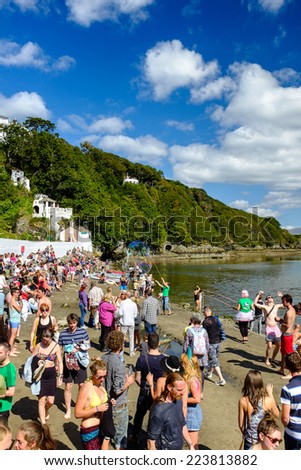 PORTMEIRION, NORTH WALES - SEPTEMBER 7TH: Holiday-makers on the beach on the River Dwyryd, on 7TH September 2014 in Portmeirion, North Wales, UK.