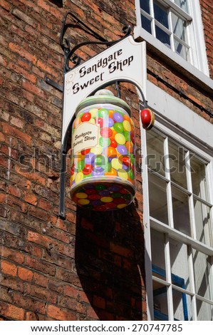 WHITBY, ENGLAND - APRIL 18: A sweet jat sign for the Sandgate Sweet Shop, on Sandgate in Whitby, North Yorkshire, England. On 18th April 2015.