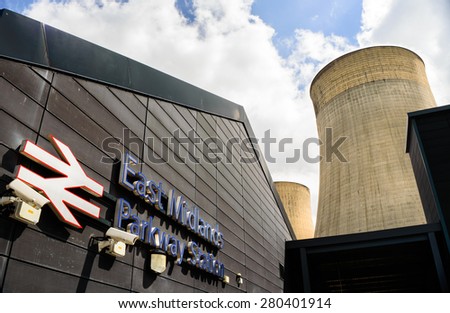 RATCLIFFE-ON-SOAR, ENGLAND - MAY 21: East Midlands Parkway train station, and cooling towers of nearby power station, near Nottingham. In Ratcliffe-On-Soar, Nottinghamshire, England on 21st May 2015.
