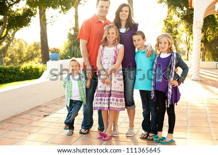 Family portrait on an outdoor patio in the evening