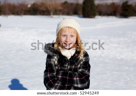Girl standing outside in the snow