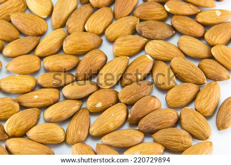 Peeled almonds nuts isolated on white background.