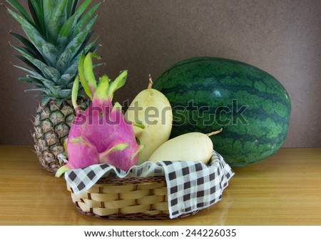 Still life fruit and vegetable basket on the wooden table