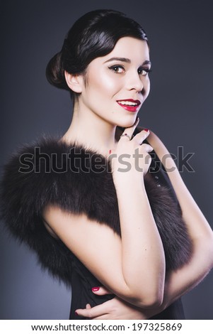 Beautiful Brunette Retro Woman with red lips make up and wave bang hairstyle