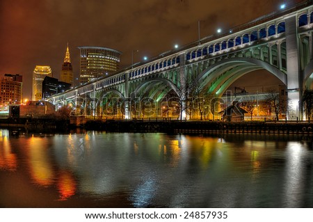 A cityscape scene with a focus on the Veteran\'s Memorial Bridge located in Cleveland, OH.