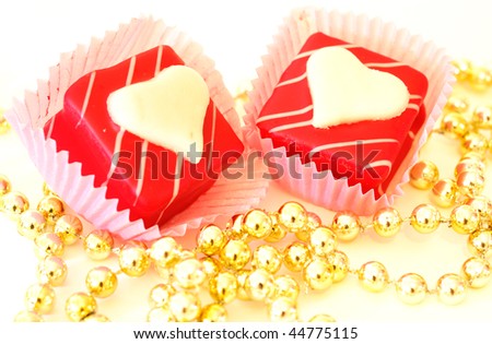 Valentine\'s candy - Small heart-shaped candies with golden pearl, ideal for your valentine\'s design.