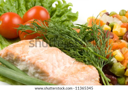 Stake from a salmon with vegetables on a plate